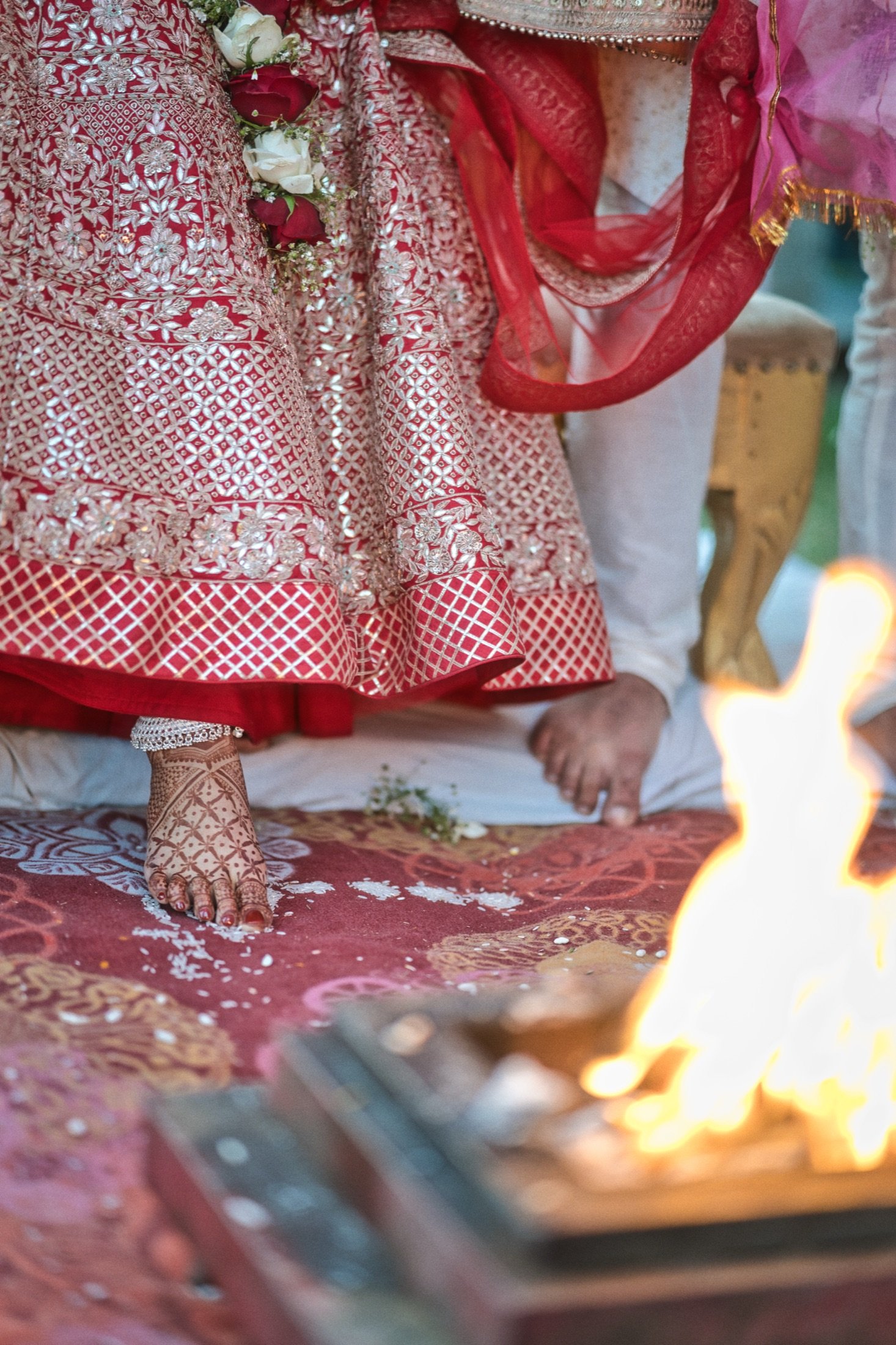 Phere: Mehendi-stained feet, the flames, and the first steps of forever.