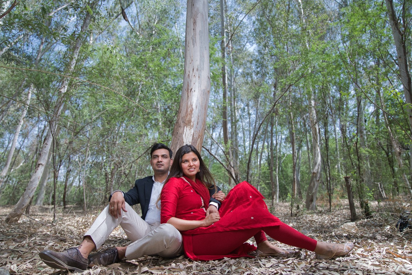 Wandering Together: Resting under the eucalyptus, all in red.