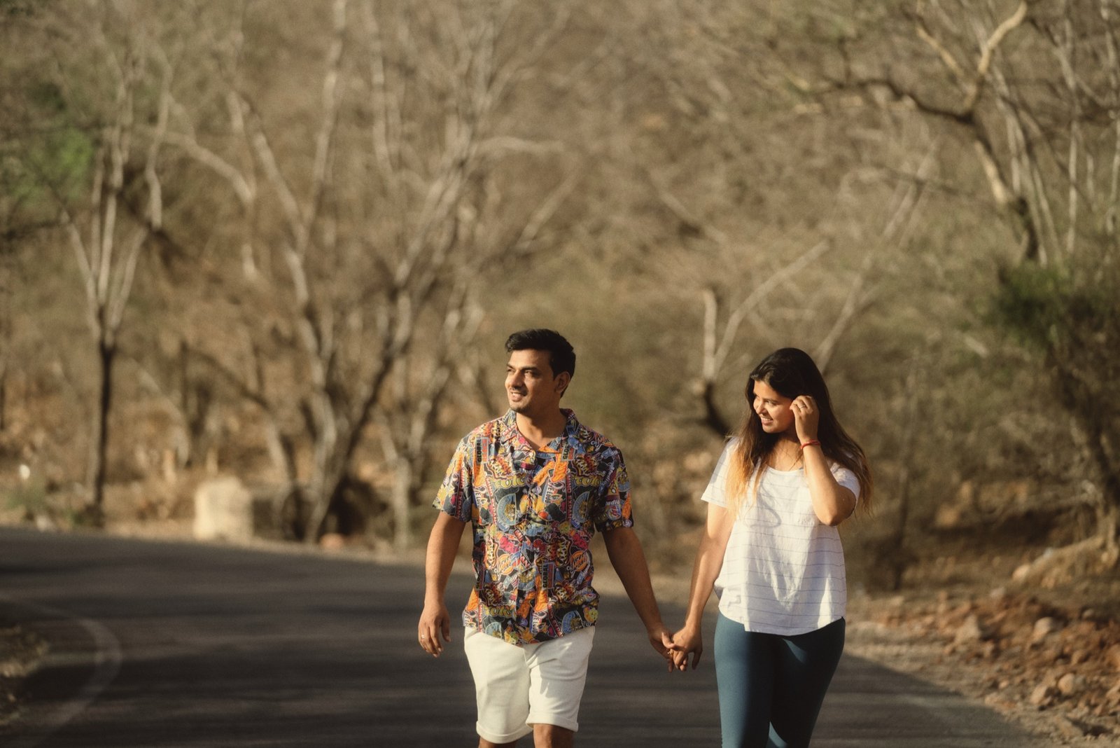 Wandering Together: Matching orange, matching smiles. A long road, unhurried.